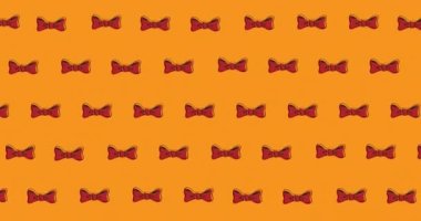 Turuncu arka planda süzülen papyonların animasyonu. elbiseler, şekiller ve hareket konsepti dijital olarak oluşturulmuş video.