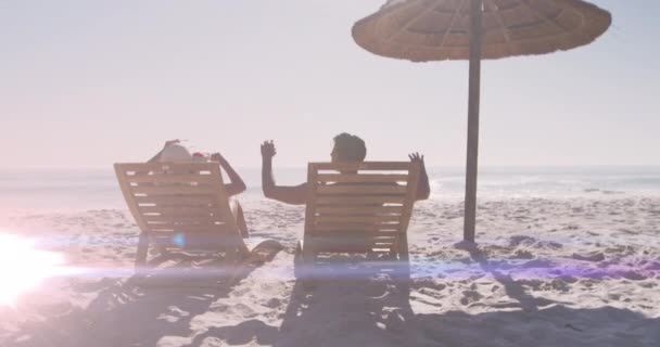 Animation Light Spots Caucasian Couple Raising Hands Beach National Relaxation — Stock Video
