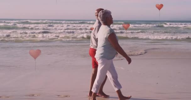 Animation Hearts Senior African American Couple Walking Sunny Beach Healthy — Stockvideo