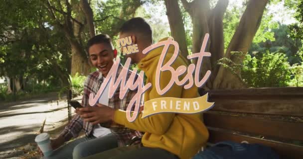 Animation Best Friend Text Happy Biracial Male Friends Using Smartphone — Vídeos de Stock
