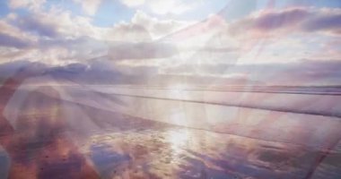 Sahilde Amerikan bayrağı taşıyan beyaz bir çiftin üzerinde okyanus manzarası canlandırması. Okyanus günü ve dijital olarak üretilen video konsepti.