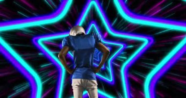 Animation of african american male american football player with helmet over shapes. global sport and digital interface concept digitally generated video.
