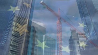 Animation of european union flag over office buildings. global business, economy, politics and cooperation concept digitally generated video.