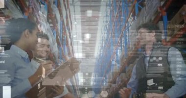 Animation of financial graphs over happy diverse female and male warehouse workers clapping hands. business, finance and delivery services concept digitally generated video.