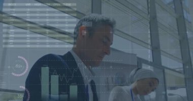 Animation of data processing over diverse business people in office. global business, finances, connections and digital interface concept digitally generated video.