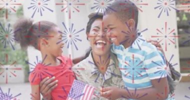Animation of fireworks over happy african american soldier mother hugging kids. usa patriotism, family and relationship concept digitally generated video.