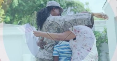 Animation of hearts over happy african american soldier mother hugging kids and husband. usa patriotism, family and relationship concept digitally generated video.