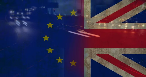 Headlights of car in urban area against animated EU and Britan flag