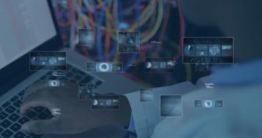 Dizüstü bilgisayar kullanan Afro-Amerikan bir adamın elinde çeşitli verilerle ekranın animasyonu. ağ, programlama, bilgisayarlar ve teknoloji konsepti dijital olarak oluşturulmuş video.