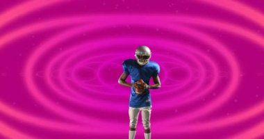 Afrika kökenli Amerikalı erkek rugby oyuncusu dairesel şekillere karşı kusursuz şekillerde rugby topu tutuyor. spor ve teknoloji konsepti