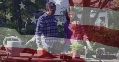 Animation of american flag over caucasian father and daughter gardening. national sons and daughters day and celebration concept digitally generated video.