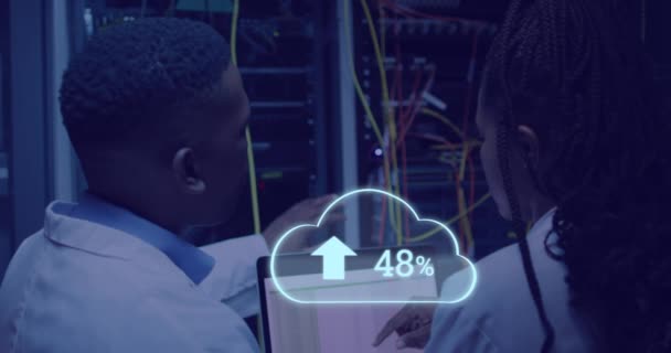 Animation Cloud Uploading African American Man Working Laptop Server Room — Αρχείο Βίντεο