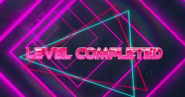 Image of pink neon geometrical shapes over level completed text. abstract, light, pattern and movement concept digitally generated image.
