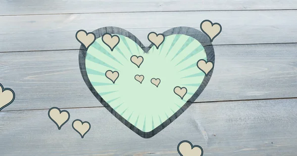 Image of rotating green striped background over heart shapes hole in grey wooden surface. shape, colour, movement, emotions and love concept digitally generated image.