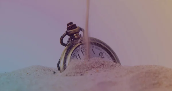 Image of clock over sand and timer. global business and digital interface concept digitally generated image.