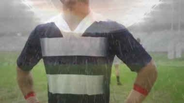 Takım arkadaşları stadyumda toplanırken beyaz bir rugby oyuncusunun kameraya baktığı animasyon.
