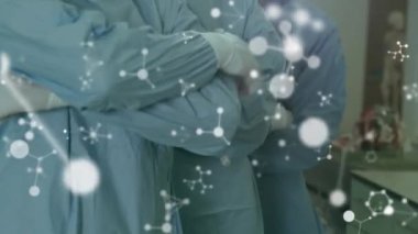 Ameliyathanede cerrahların üzerinde hareket eden moleküllerin animasyonu