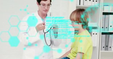 Medical data processing against caucasian female doctor treating a caucasian boy at hospital. medical research and science technology concept