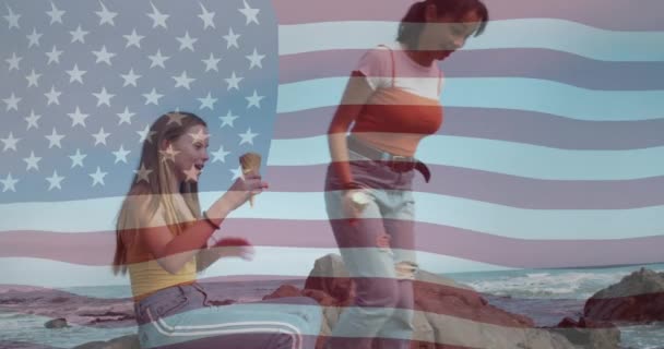 Animation American Flag Diverse Female Couple Beach International Youth Day — Wideo stockowe