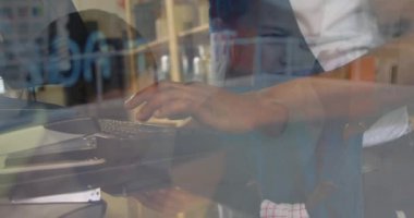 Animation of men using computer over businesswomen. global business, success, connections and data processing concept digitally generated video.