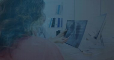 Animation of house icon over men using computer. global business, success, connections and data processing concept digitally generated video.