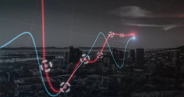 Neon statistical data processing against aerial view of cityscape at night. business technology and statistics concept