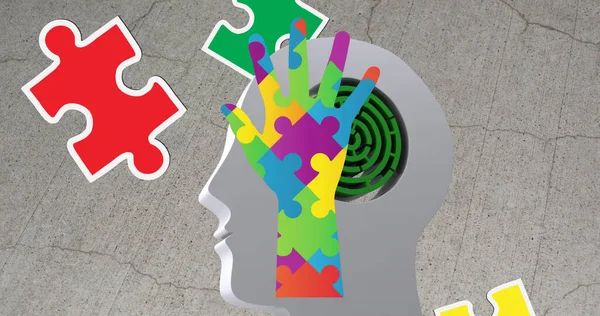 Image of autism colourful puzzle pieces forming hand and head with labyrinth. autism, learning difficulties, support and awareness concept digitally generated image