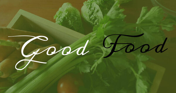 Image of good food text over fresh vegetables. world vegan day and celebration concept digitally generated image.