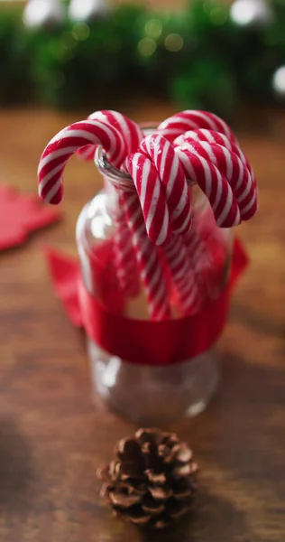 Vertical Close Shot Candy Canes Jar Surrounded Christmas Decorations Wooden — Stock Photo, Image