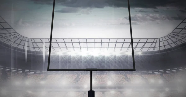 フラッドライトスタジアムのアメリカンフットボールのゴールポストと曇天のイメージ スポーツ競技アメリカンフットボールのコンセプトをデジタルで生成し — ストック写真