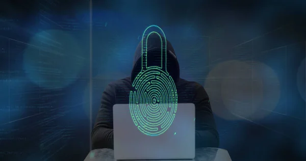 Image of digital interface over biometric fingerprint and hacker in hood using laptop computer. Global network online security concept digital composite.
