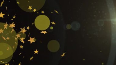 Siyah arka planda süzülen yıldız ve bokeh animasyonları. Yeni yıl arifesi ve dijital olarak üretilen video konsepti.