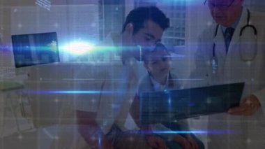 Data processing over caucasian senior male doctor discussing x-ray reports with man and his daughter. Medical healthcare and technology concept