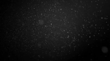 Karanlık arka planda yağan karın animasyonu. Noel, kış, gelenek ve kutlama konsepti dijital olarak oluşturulmuş video.