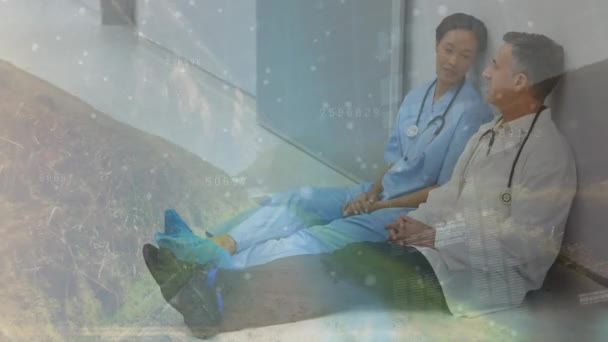 Data Processing Caucasian Male Doctor Female Health Worker Sitting Hospital — Stockvideo