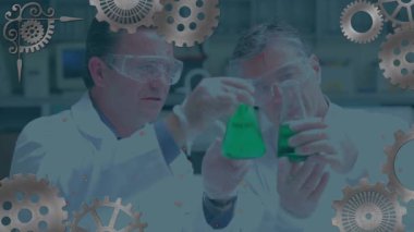 Animation of cogs are spinning over caucasian male scientists with beakers. global science, research and data processing concept digitally generated video.