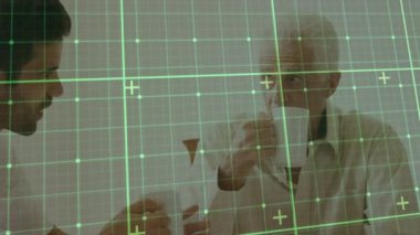 Animation of data processing over caucasian male doctor taking care of senior patient with tea. senior health, well being, medicine and technology concept digitally generated video.