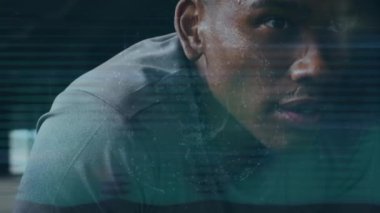 Globe of network of connections against close up of a tired african american fit man. sports and technology concept