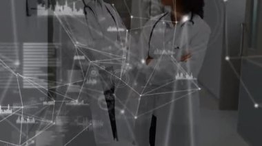 Animation of network of connections over two diverse doctors. Global medicine, technology, data processing and digital interface concept digitally generated video.