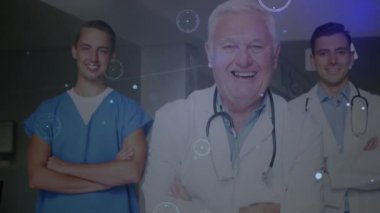 Animation of network of connections over diverse group of doctors. Global medicine, technology, data processing and digital interface concept digitally generated video.