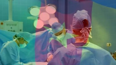 Ameliyat sırasında çeşitli doktorların üzerinde kamerun bayrağı animajı. küresel tıp ve vatanseverlik kavramı dijital olarak üretilen video.