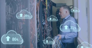 Animation of clouds with increasing numbers over stressed caucasian man standing at servers. cloud computing, data uploading, computers and technology concept digitally generated video.