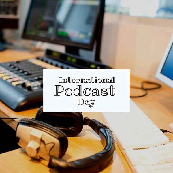 Composite of keyboard, headphones, computer and sound mixer on table and international podcast day. Text, recording studio, broadcasting, communication, media and technology concept.