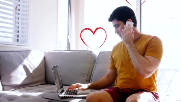 Multiple Red Heart Icons Falling Caucasian Man Using Laptop Talking — Vídeo de stock