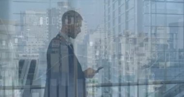 Animation of financial graphs over caucasian businessman using smartphone in office. Business, finance, economy and technology concept digitally generated video.