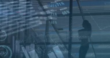 Animation of graphs and financial data over office space and businesspeople walking. Business, finance, economy and technology concept digitally generated video.