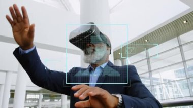 Multiple screens with data processing over african american senior man wearing vr headset at office. Digital interface and futuristic technology concept