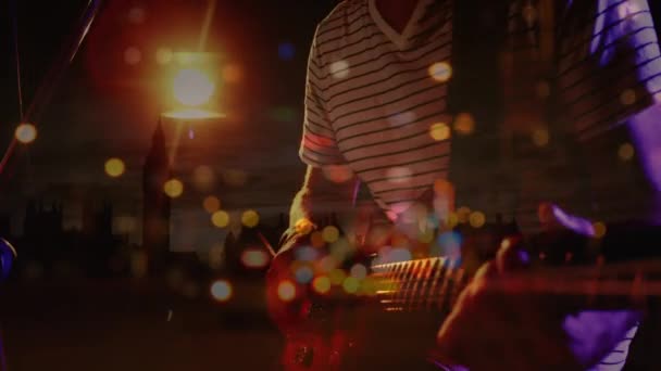 Animation Blurred Night Road Traffic Midsection Caucasian Man Playing Guitar — Vídeo de Stock