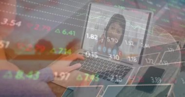 Animation of financial data and caucasian woman having video call on laptop over solar panels. Green energy, eco power, finance and economy concept digitally generated video.