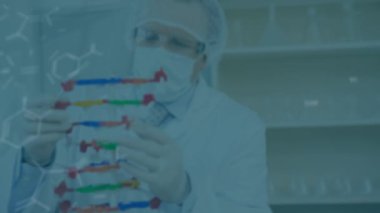 Animation of molecules over caucasian male scientist. Global science and digital interface concept digitally generated video.